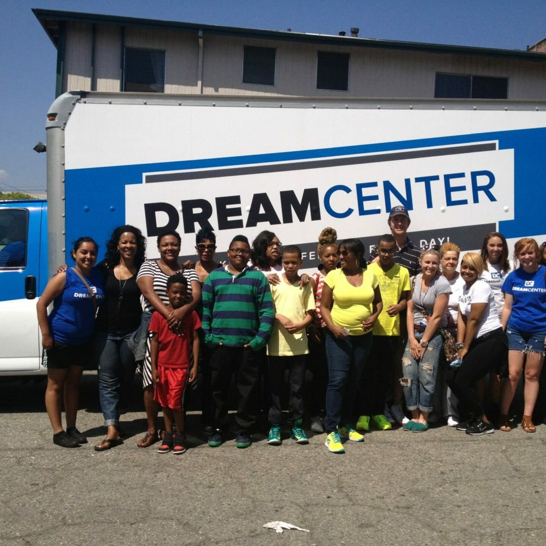 Individuals at an outreach event at Dream Center
